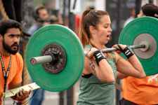 photo of a woman lifting a barbell